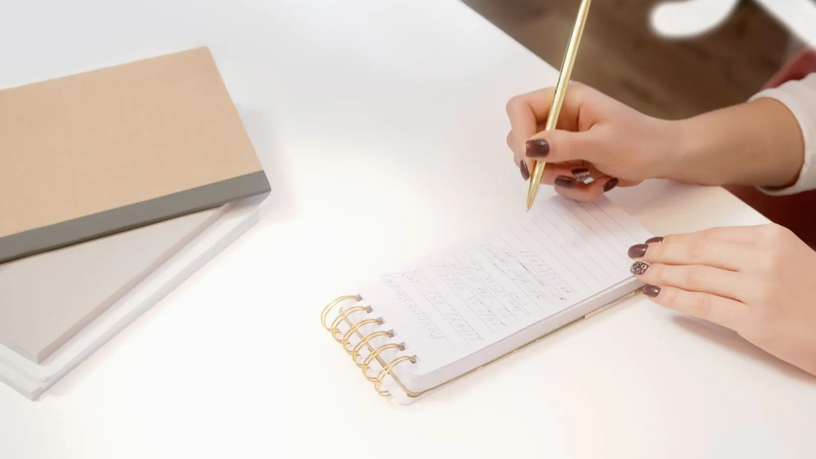 Writing copy by hand in a notebook