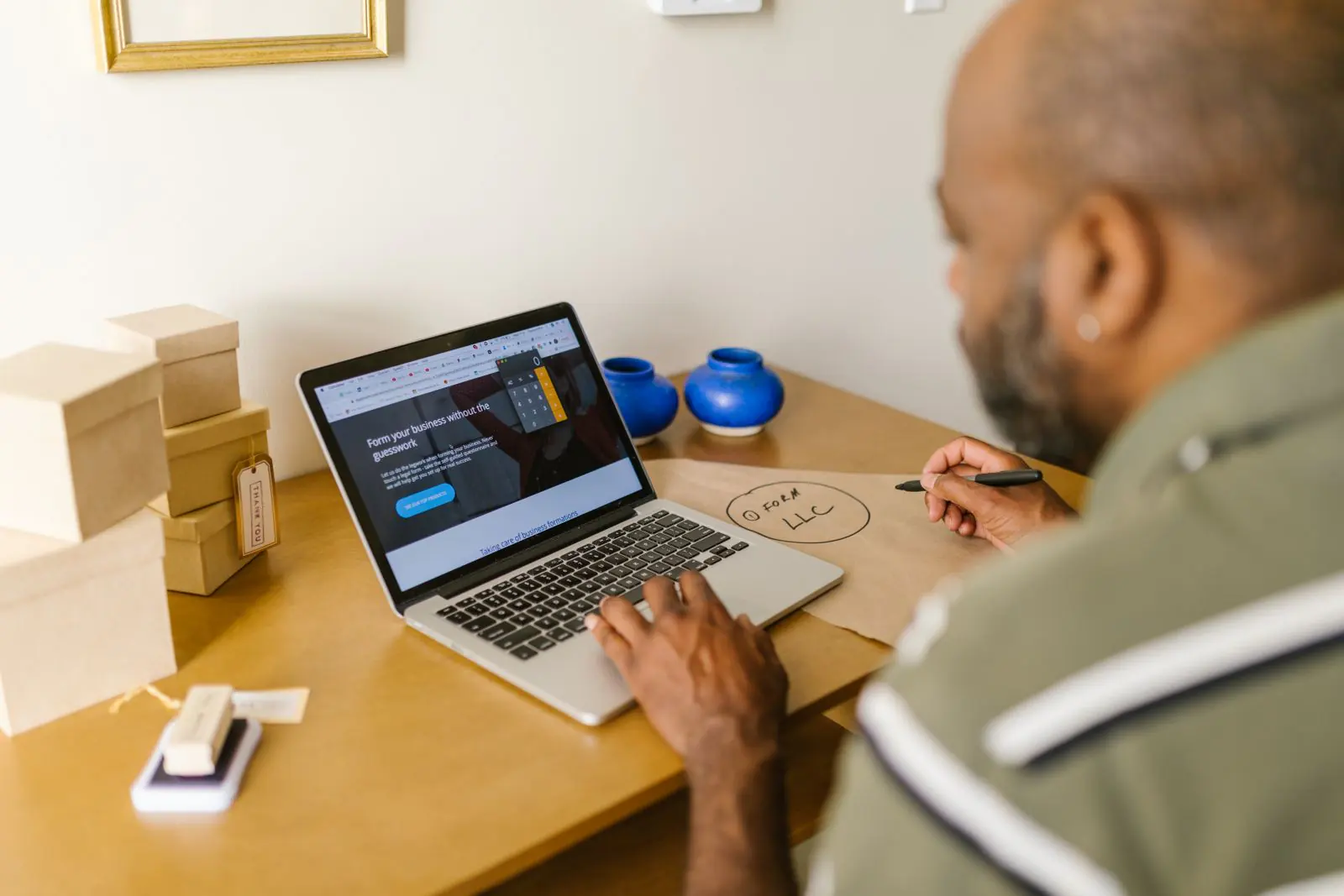 A business owner reviewing a website on a laptop
